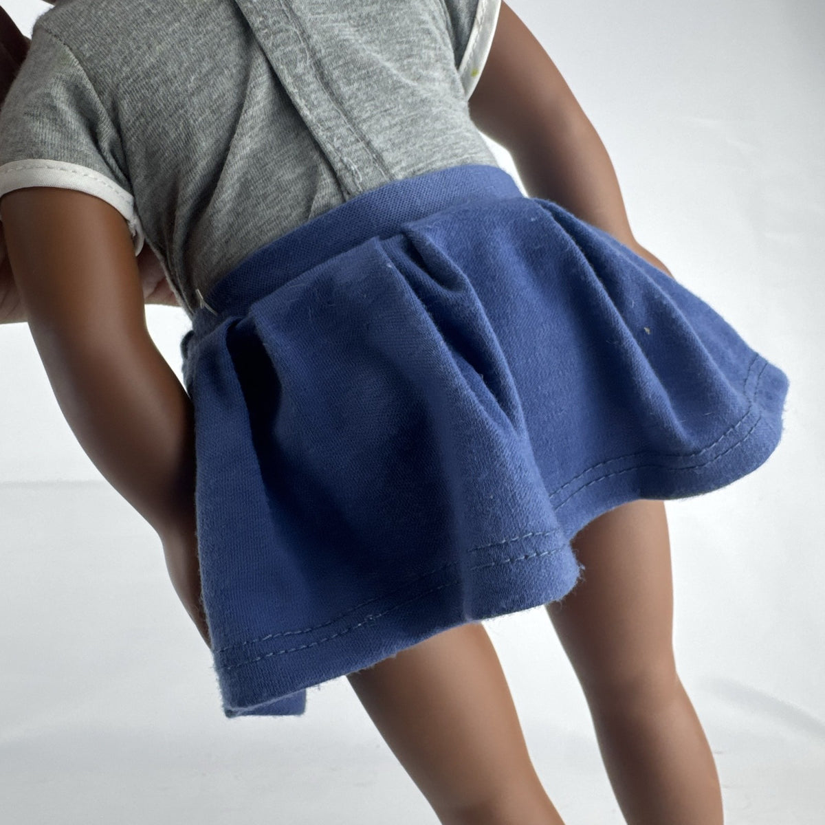 Cititoy 18-inch vinyl African American girl doll wearing grey shirt, blue skirt, and yellow shoes