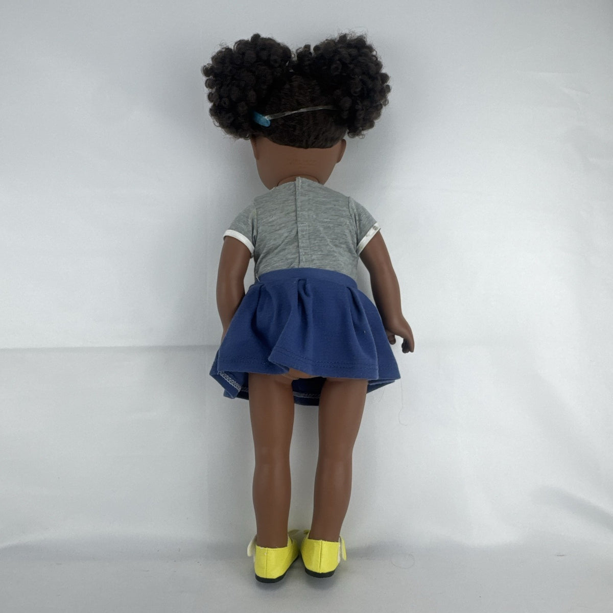 Cititoy 18-inch vinyl African American girl doll wearing grey shirt, blue skirt, and yellow shoes
