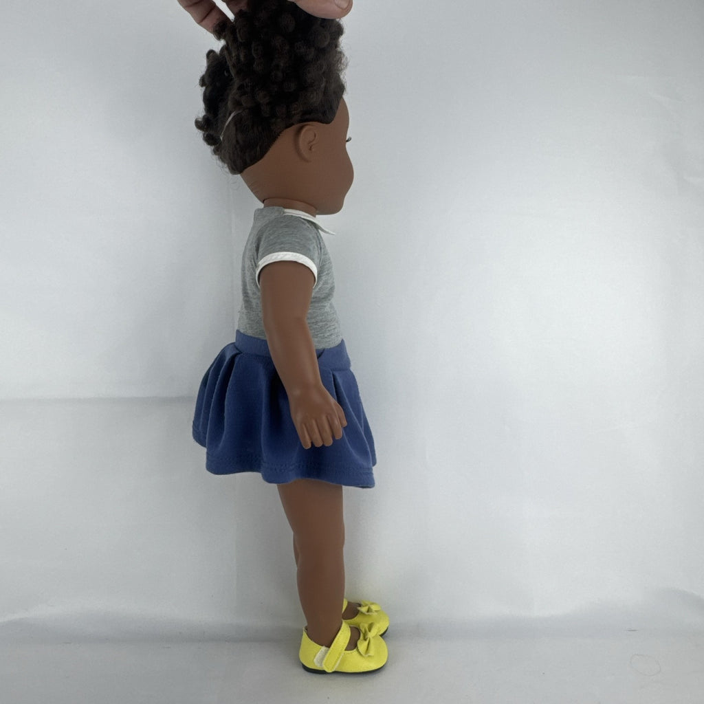 Cititoy 18-inch vinyl African American girl doll wearing grey shirt, blue skirt, and yellow shoes