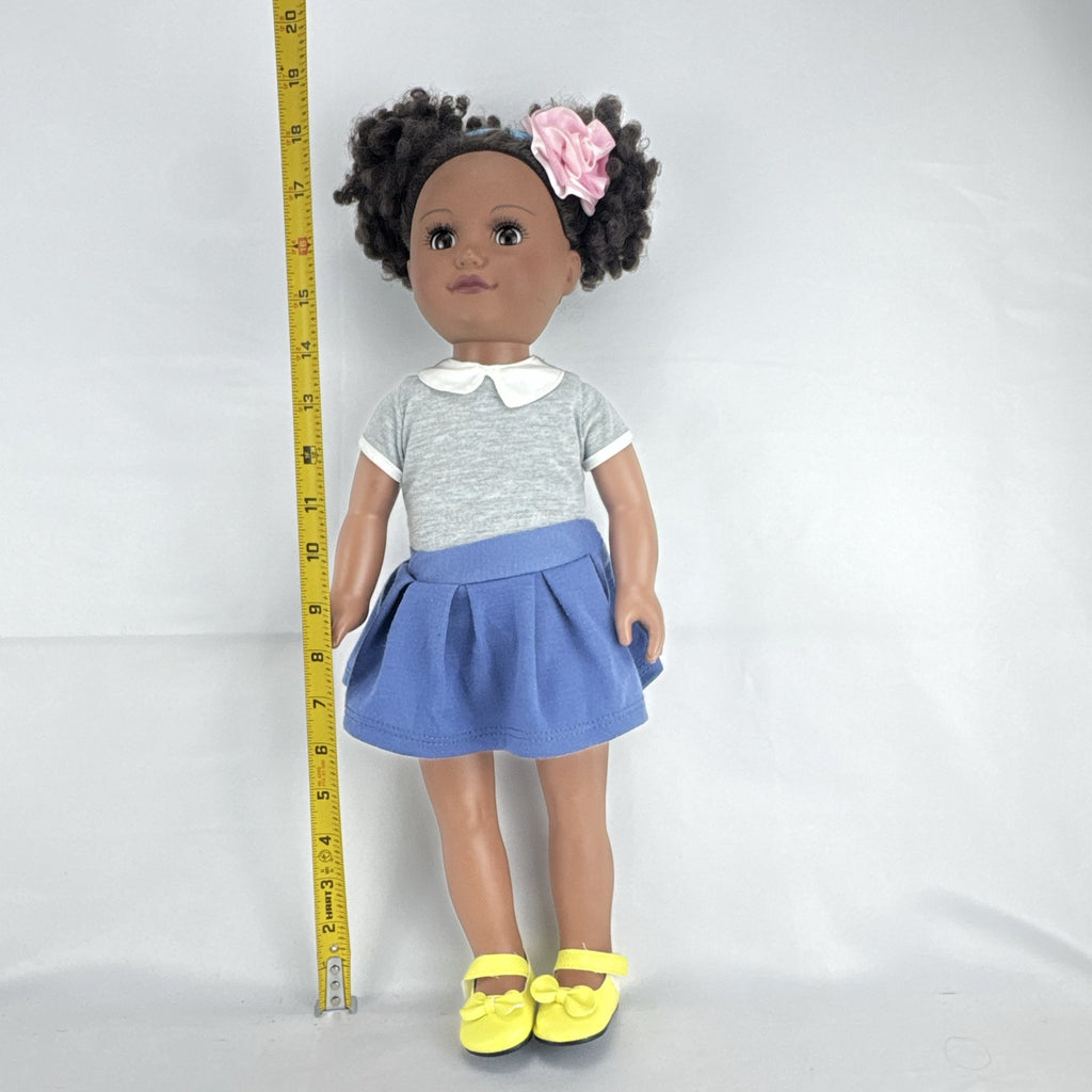 Cititoy 18-inch vinyl African American girl doll wearing grey shirt, blue skirt, and yellow shoes