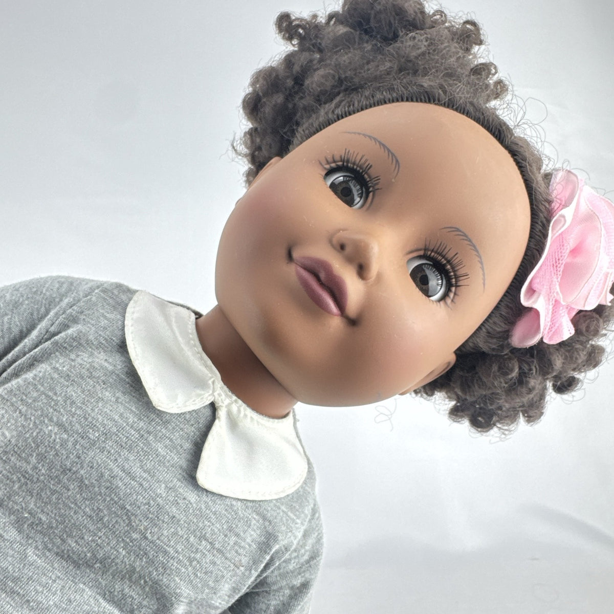 Cititoy 18-inch vinyl African American girl doll wearing grey shirt, blue skirt, and yellow shoes