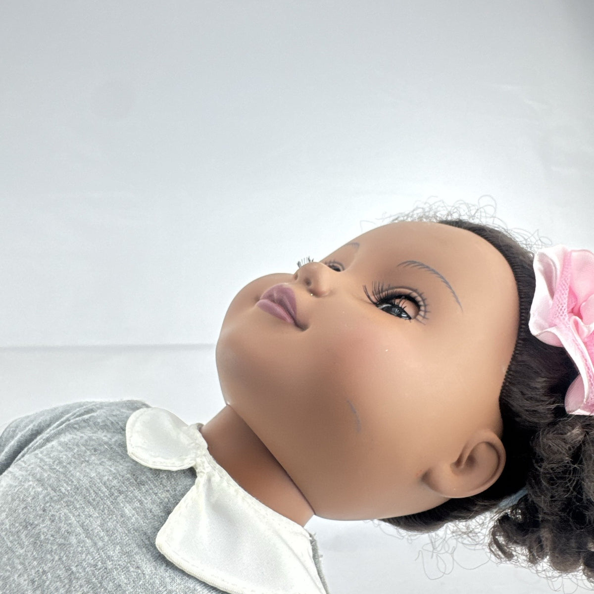 Cititoy 18-inch vinyl African American girl doll wearing grey shirt, blue skirt, and yellow shoes