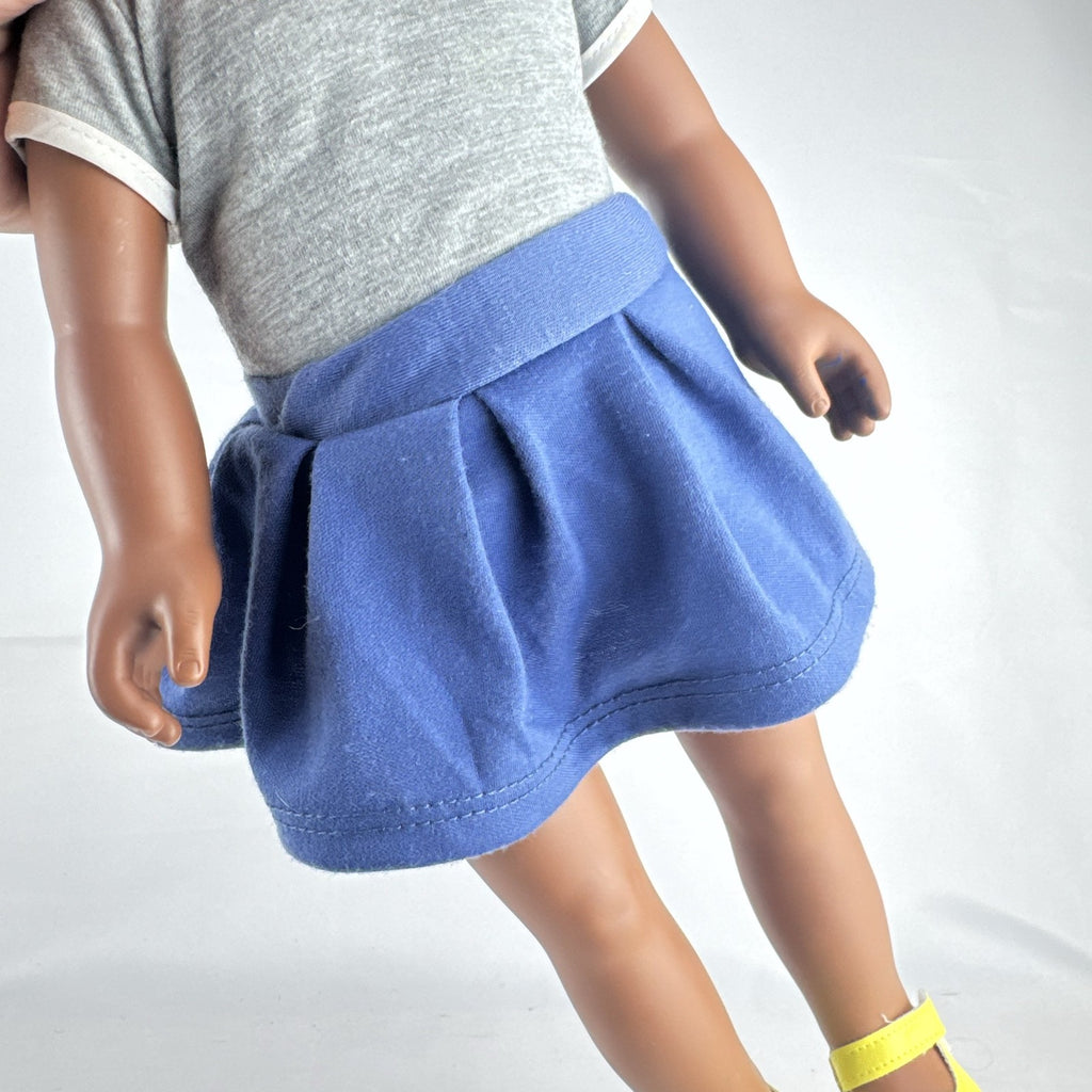Cititoy 18-inch vinyl African American girl doll wearing grey shirt, blue skirt, and yellow shoes