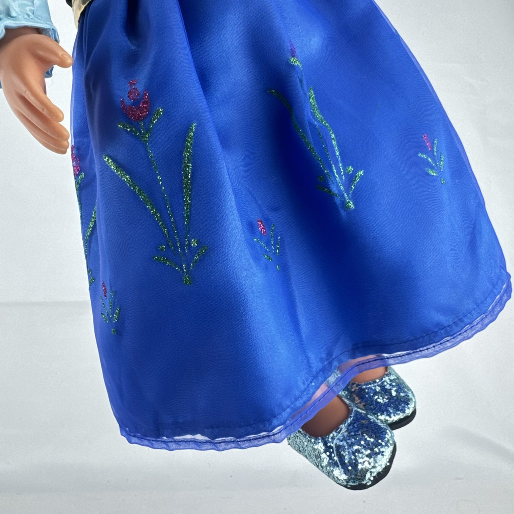 Battat Our Generation 18-inch blonde doll wearing a Disney Frozen Anna dress and blue glitter shoes