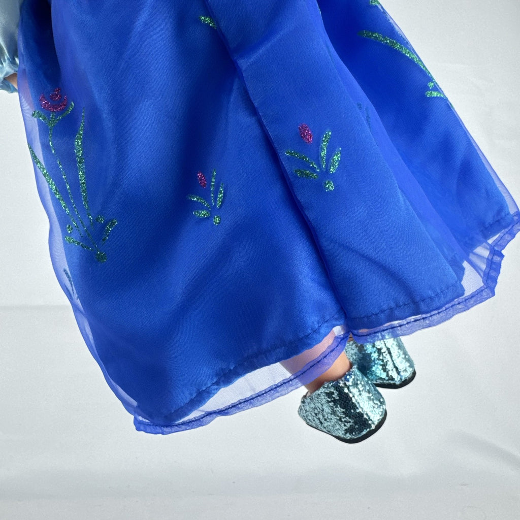 Battat Our Generation 18-inch blonde doll wearing a Disney Frozen Anna dress and blue glitter shoes