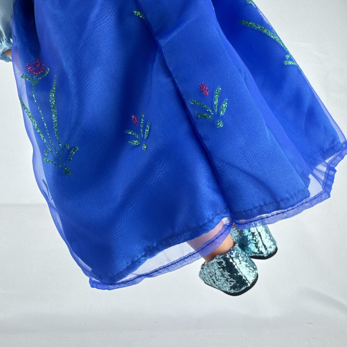 Battat Our Generation 18-inch blonde doll wearing a Disney Frozen Anna dress and blue glitter shoes