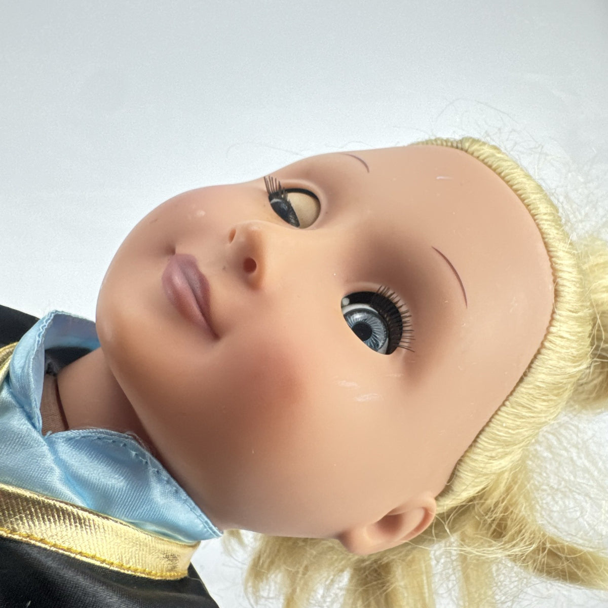 Battat Our Generation 18-inch blonde doll wearing a Disney Frozen Anna dress and blue glitter shoes