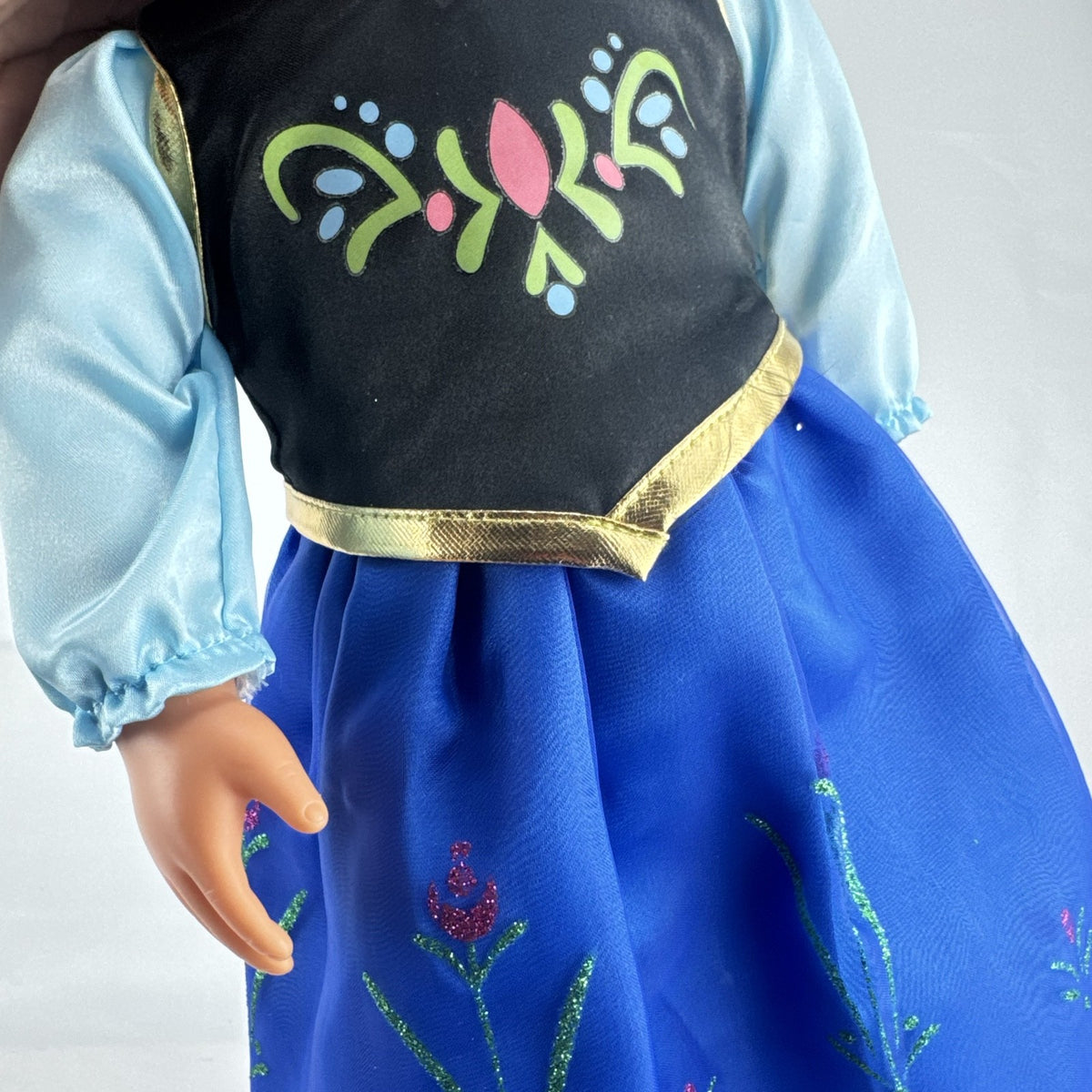 Battat Our Generation 18-inch blonde doll wearing a Disney Frozen Anna dress and blue glitter shoes