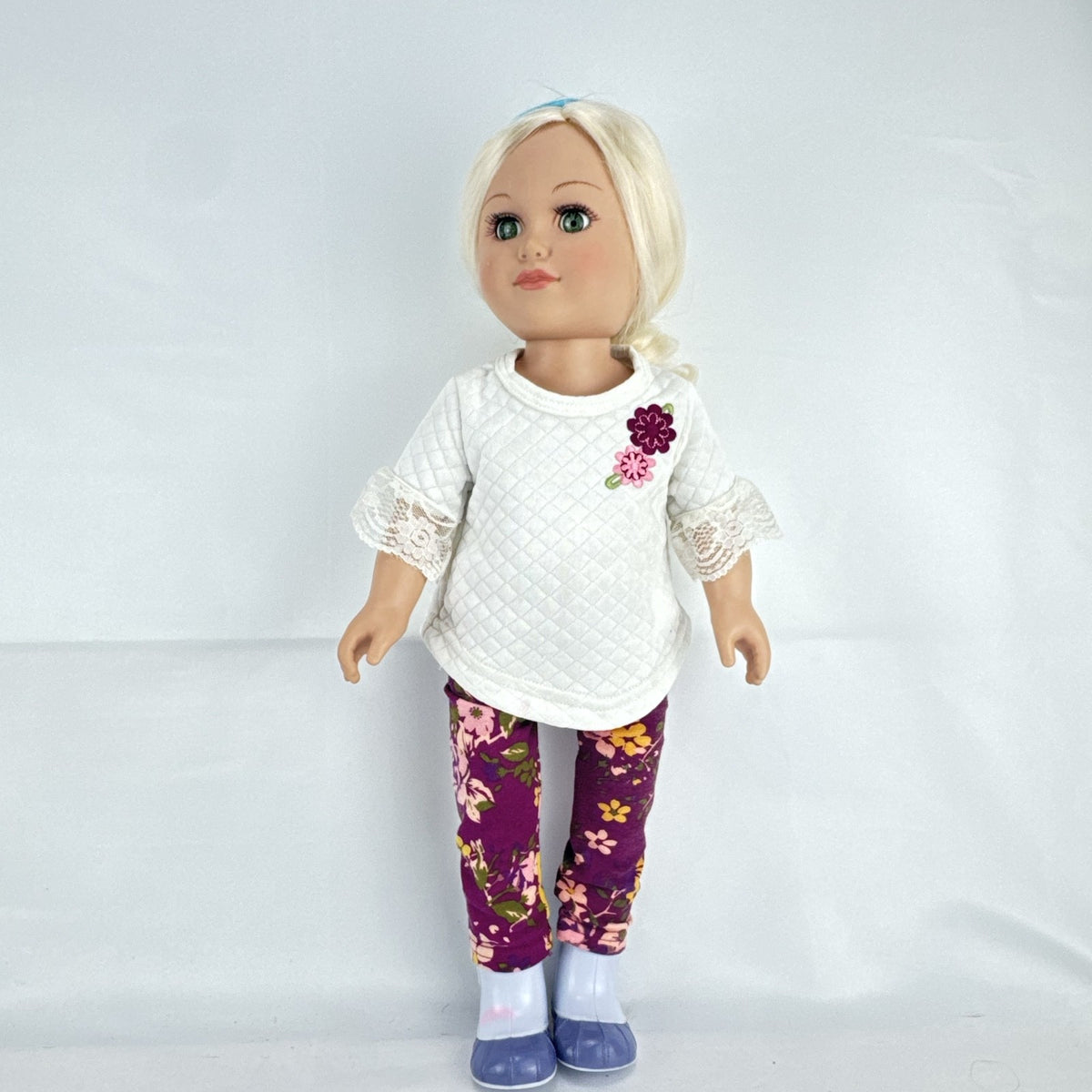 Cititoy 18-inch vinyl girl doll with curly blonde hair, blue highlights, green eyes, and floral outfit