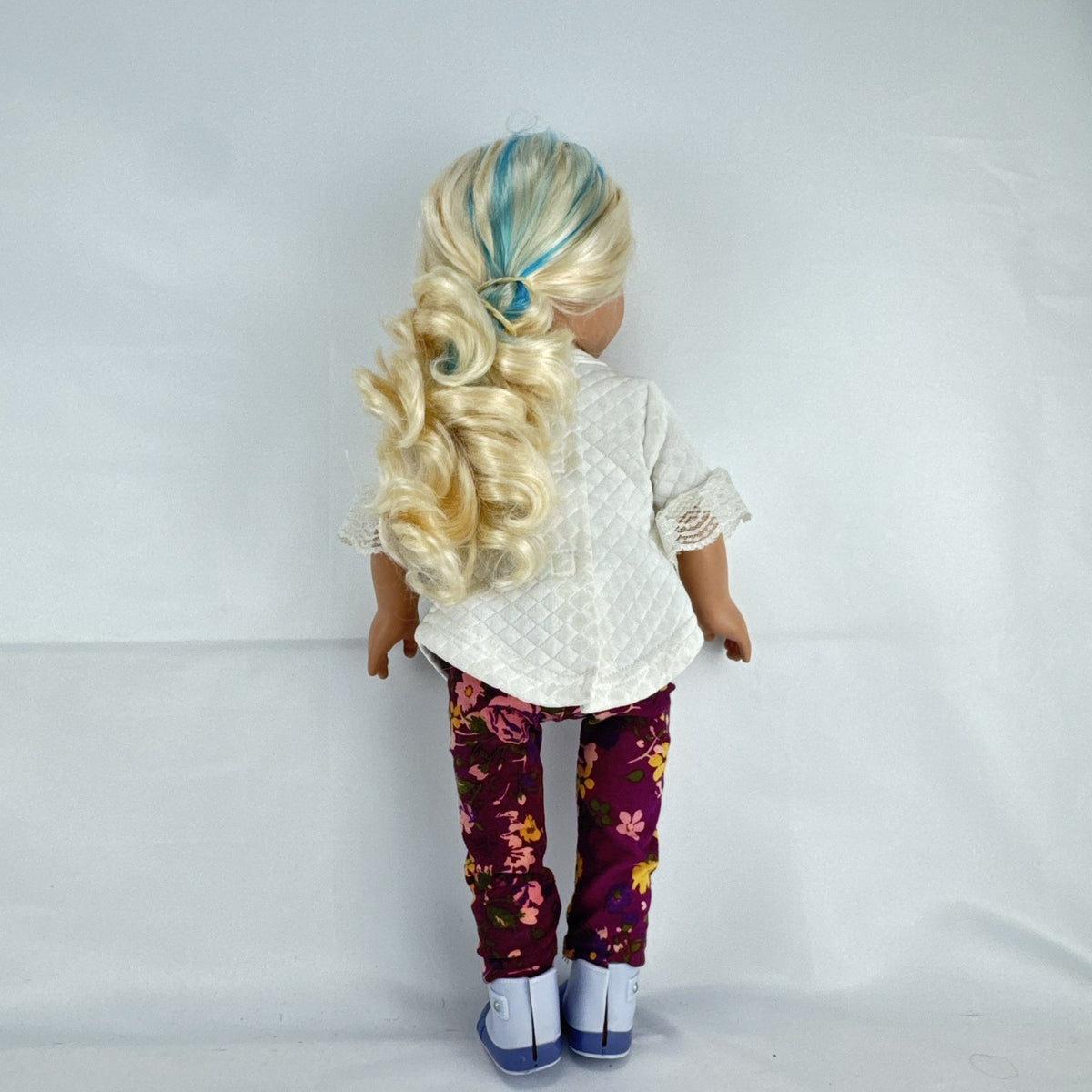 Cititoy 18-inch vinyl girl doll with curly blonde hair, blue highlights, green eyes, and floral outfit