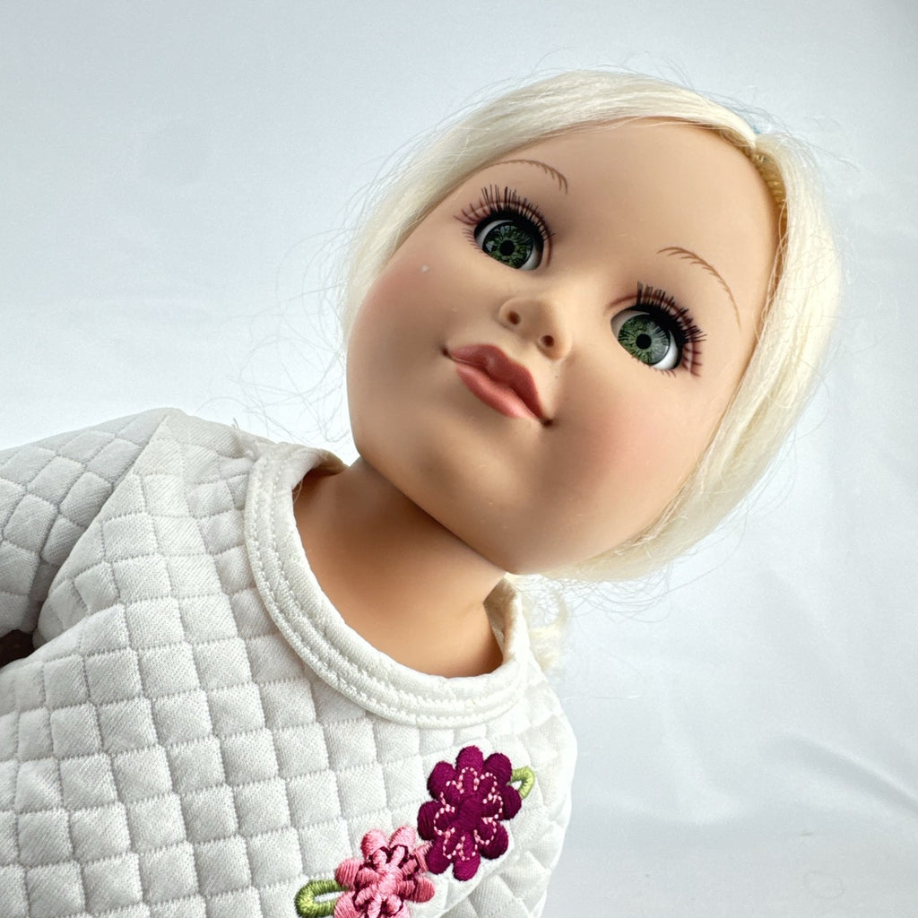 Cititoy 18-inch vinyl girl doll with curly blonde hair, blue highlights, green eyes, and floral outfit