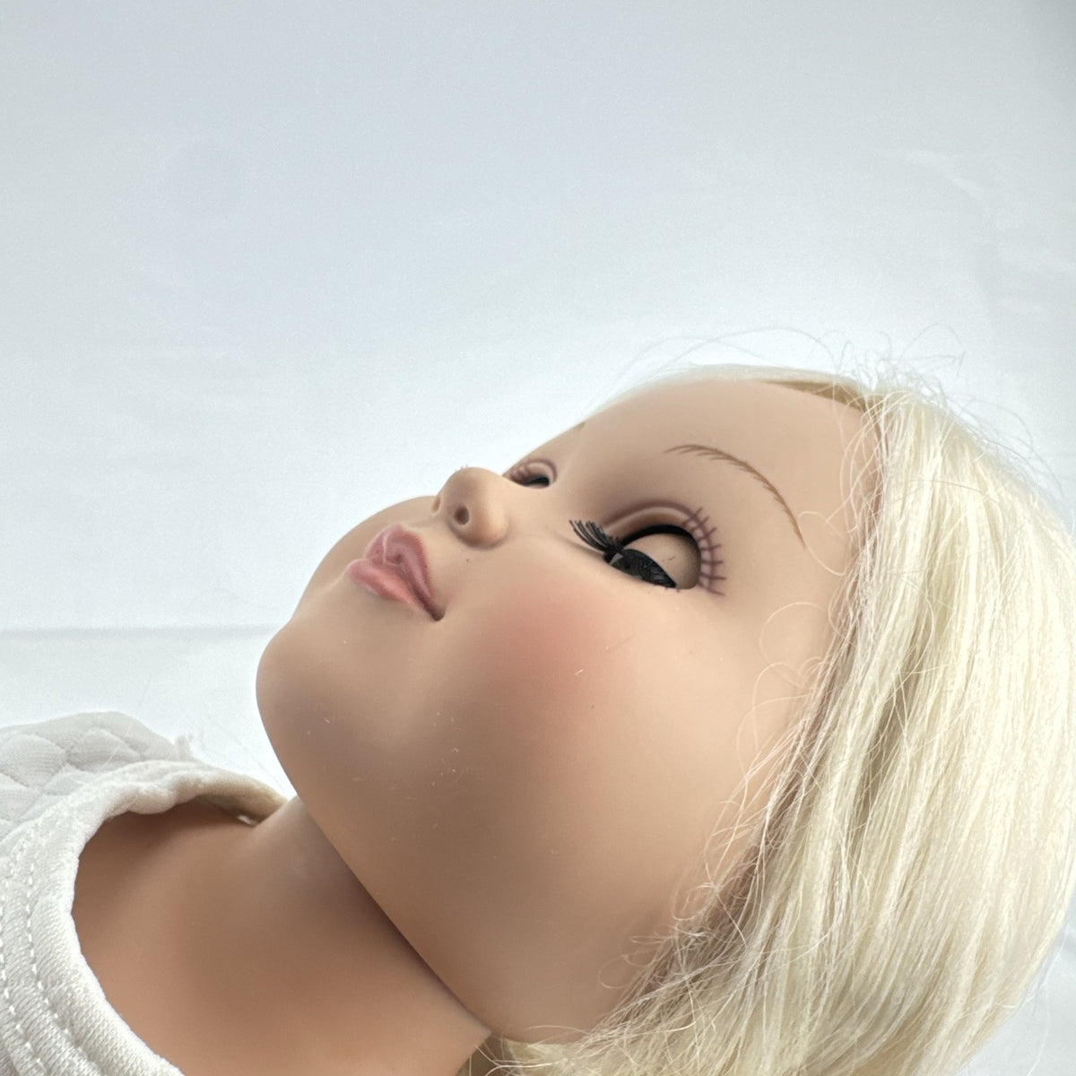 Cititoy 18-inch vinyl girl doll with curly blonde hair, blue highlights, green eyes, and floral outfit
