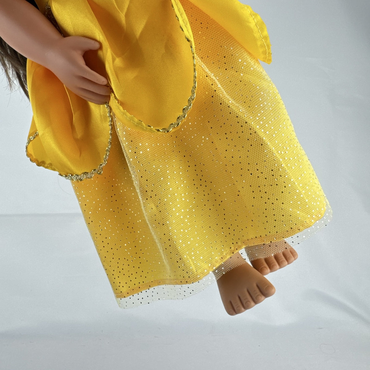 Battat Our Generation 18-inch doll with brown hair and eyes wearing a yellow princess gown