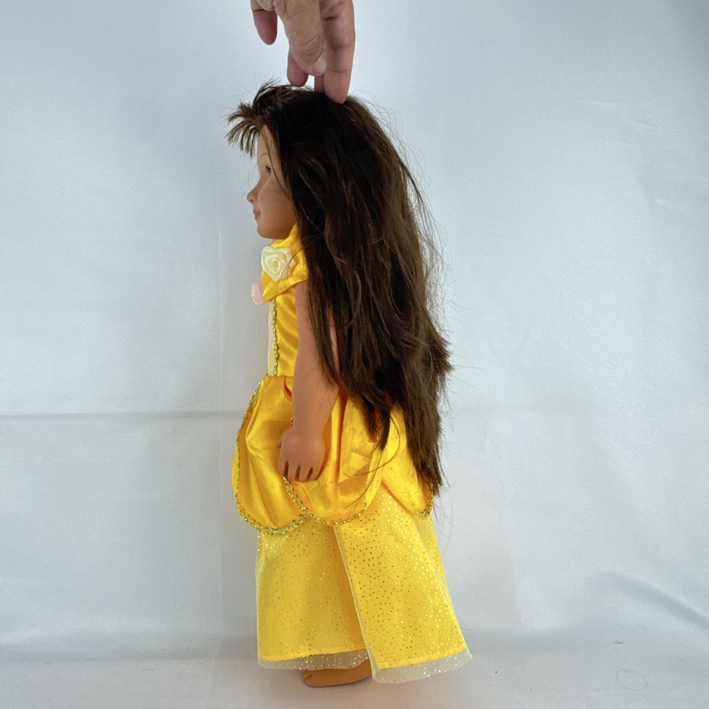 Battat Our Generation 18-inch doll with brown hair and eyes wearing a yellow princess gown