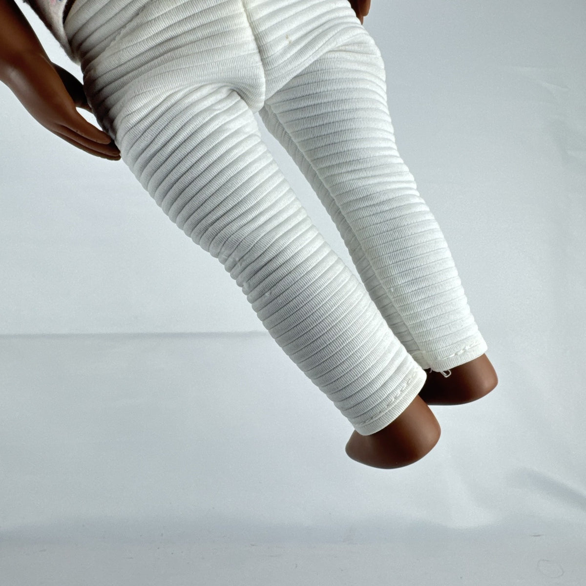 Battat Our Generation 18-inch African American doll with curly dark brown hair wearing a star shirt and white pants