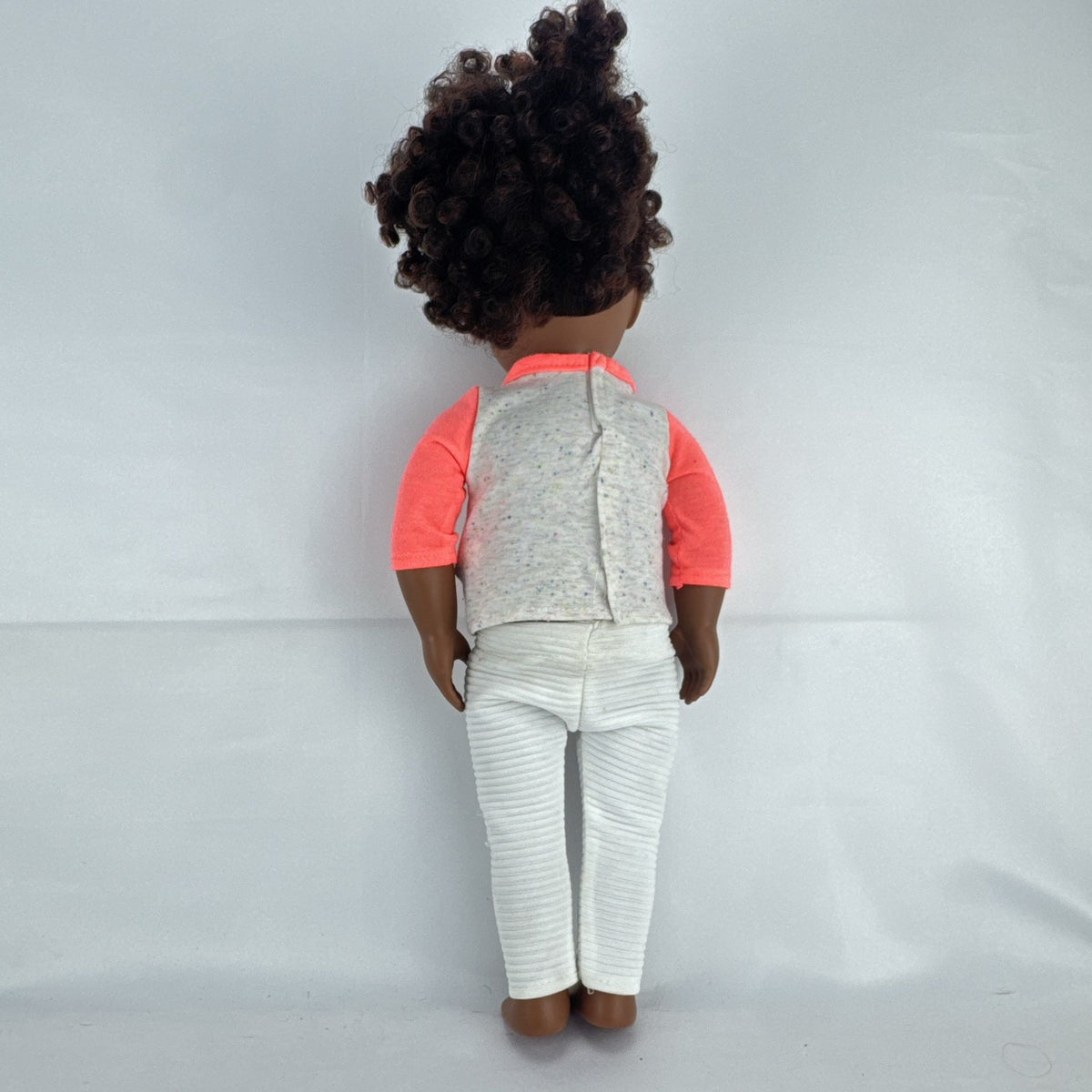 Battat Our Generation 18-inch African American doll with curly dark brown hair wearing a star shirt and white pants