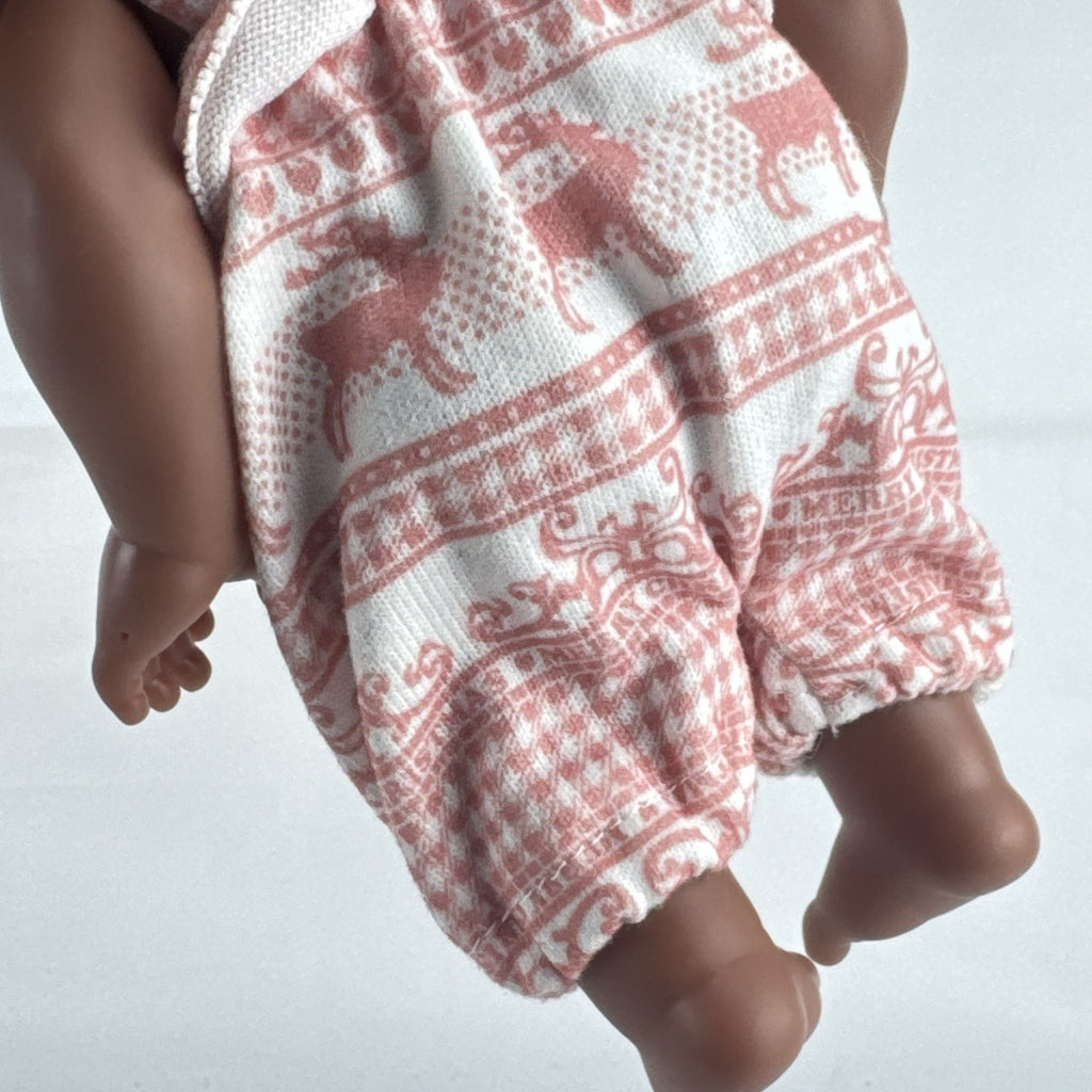 Smart Zone 10-inch African American vinyl baby doll with dark brown curly afro puff pigtails in a pink reindeer romper