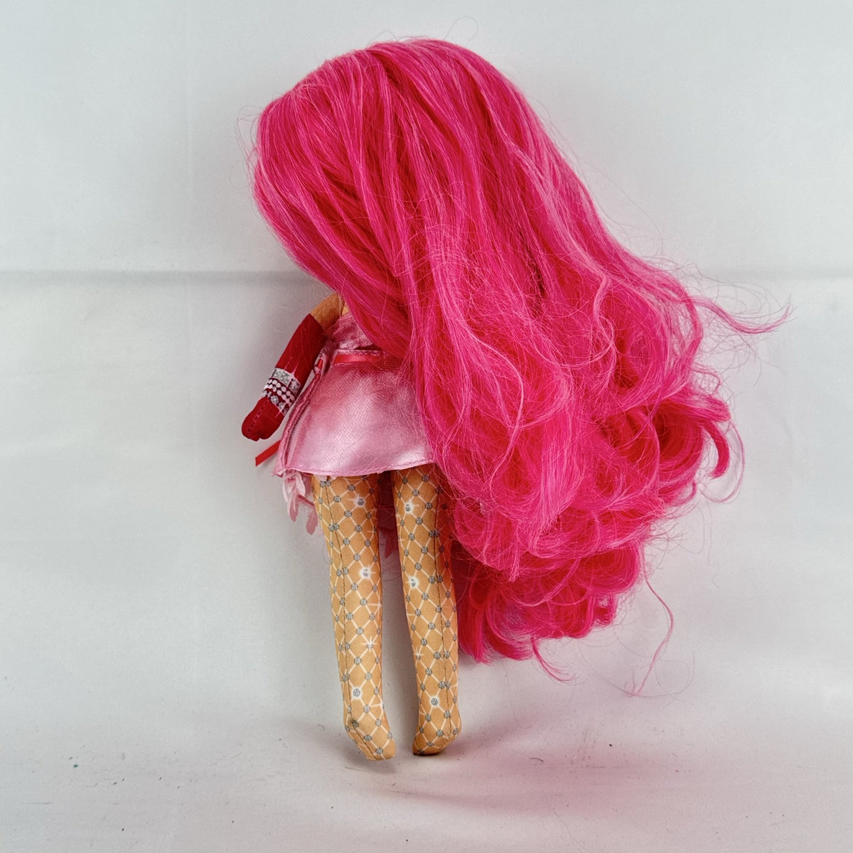 MGA Na! Na! Na! Surprise Teens 11-inch soft plush doll with long pink hair and ruffled dress