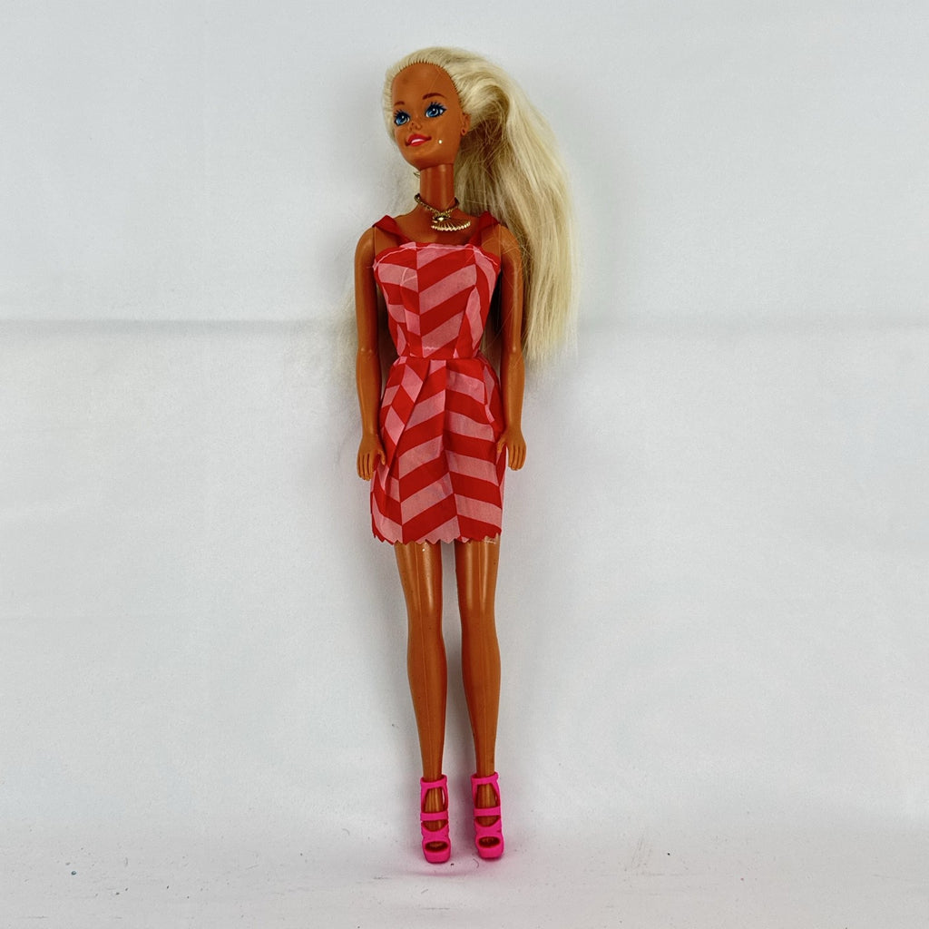 Vintage Mattel Barbie doll with blonde hair, Superstar face sculpt, chevron mini dress, and shell necklace