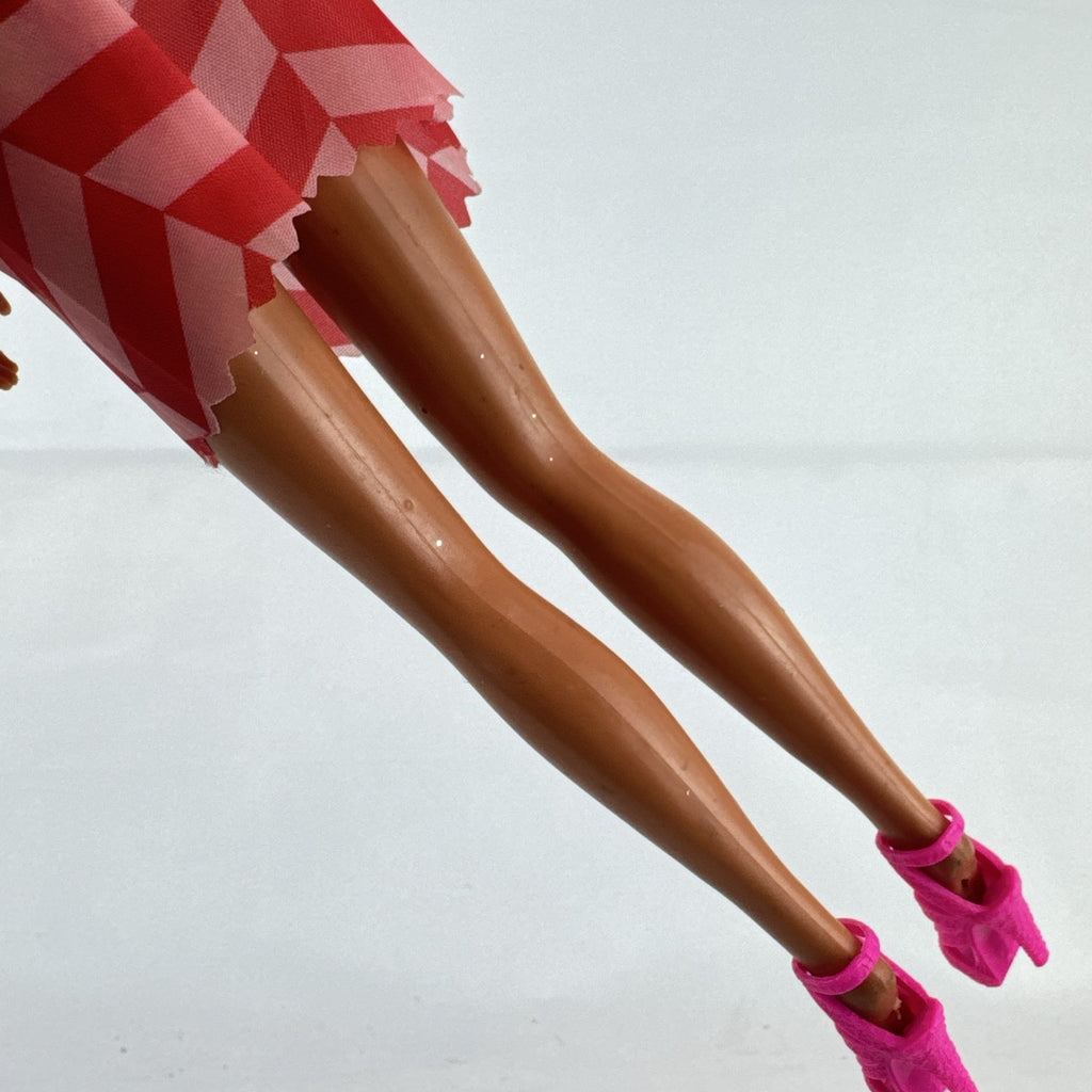 Vintage Mattel Barbie doll with blonde hair, Superstar face sculpt, chevron mini dress, and shell necklace