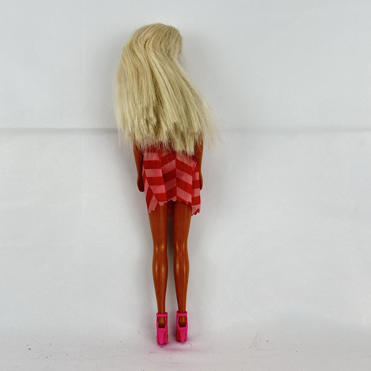 Vintage Mattel Barbie doll with blonde hair, Superstar face sculpt, chevron mini dress, and shell necklace