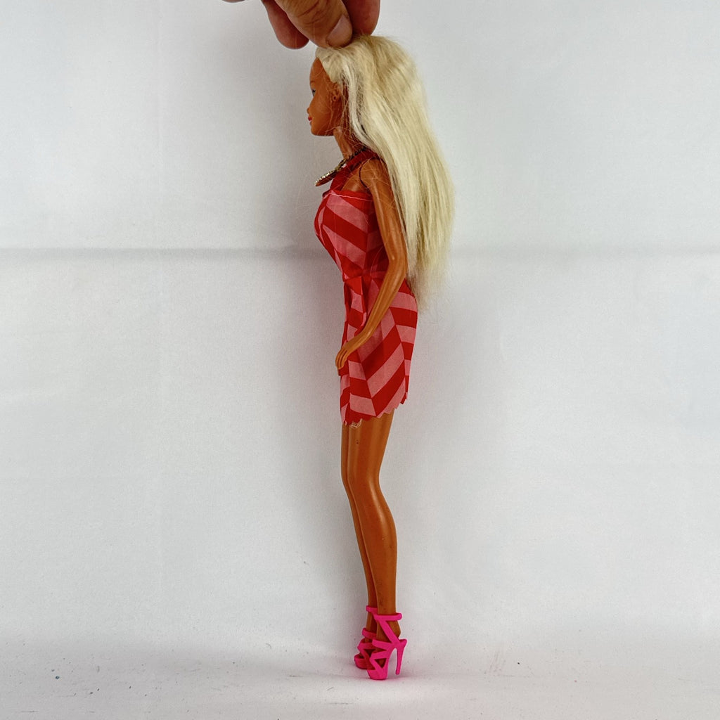 Vintage Mattel Barbie doll with blonde hair, Superstar face sculpt, chevron mini dress, and shell necklace