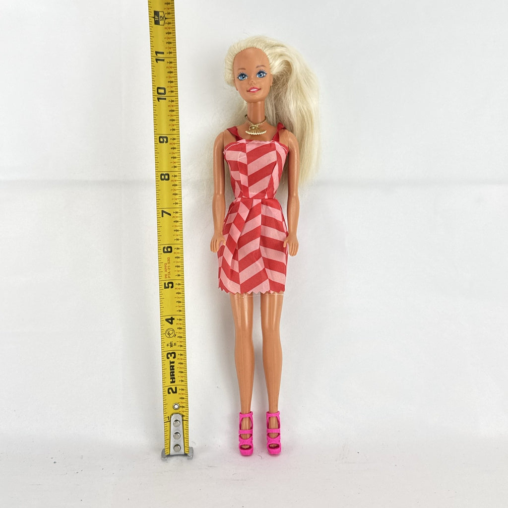 Vintage Mattel Barbie doll with blonde hair, Superstar face sculpt, chevron mini dress, and shell necklace