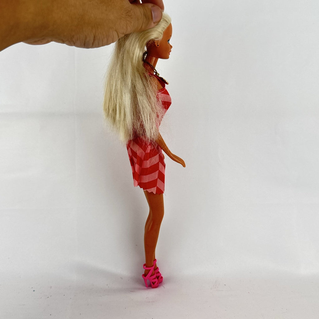 Vintage Mattel Barbie doll with blonde hair, Superstar face sculpt, chevron mini dress, and shell necklace