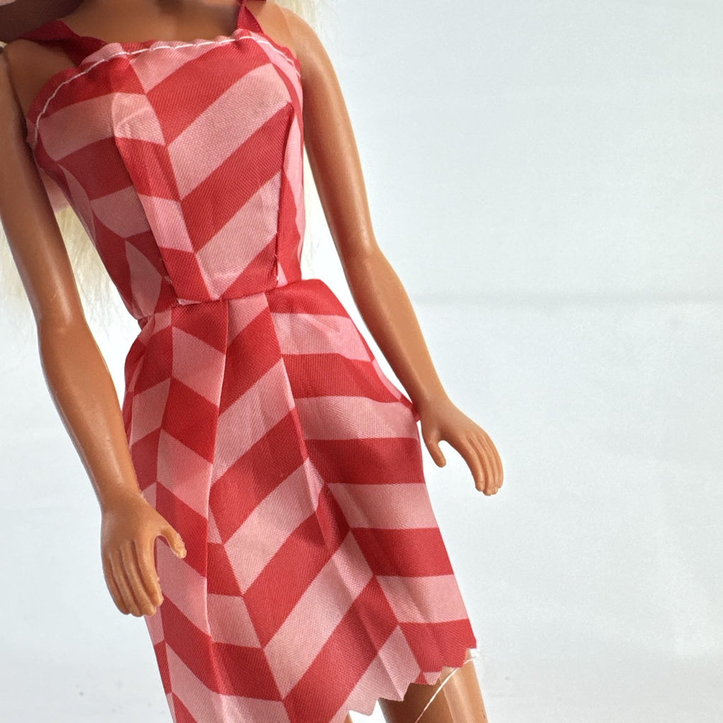 Vintage Mattel Barbie doll with blonde hair, Superstar face sculpt, chevron mini dress, and shell necklace