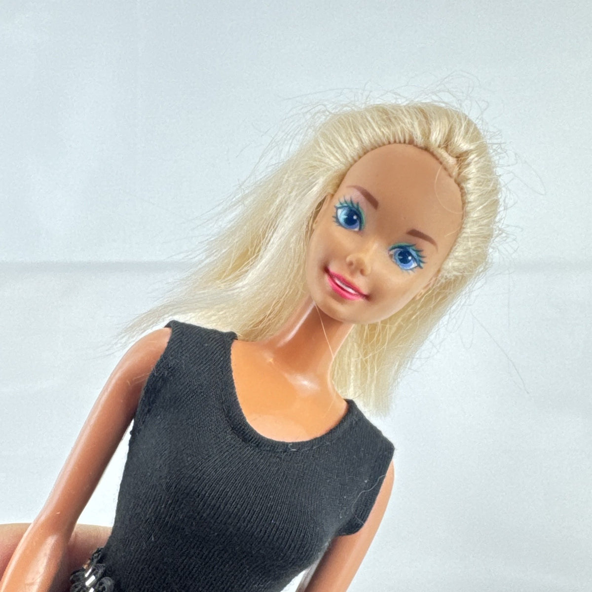 Vintage 1976 Mattel Superstar Barbie doll wearing a leopard print mini dress and red heels
