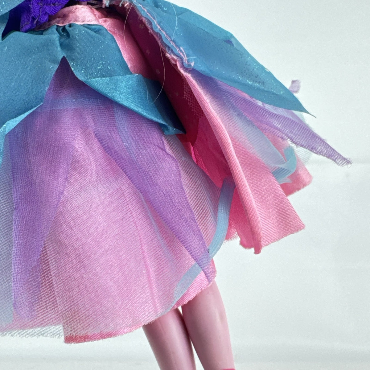 Mattel blonde Barbie ballerina doll in purple bodice and layered pink and teal tulle tutu