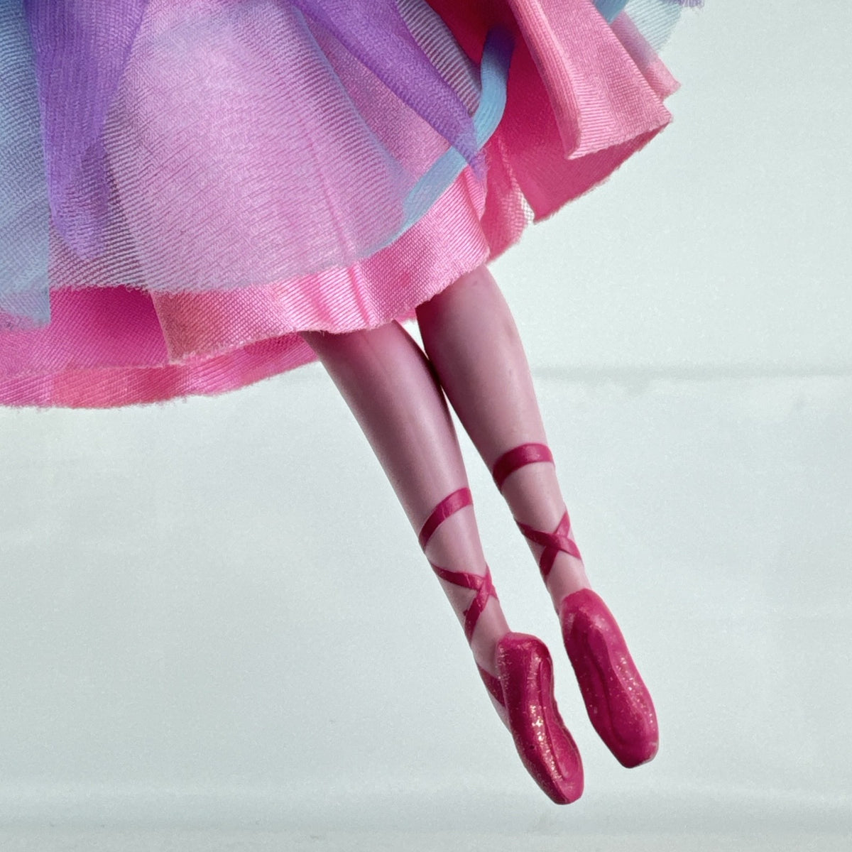 Mattel blonde Barbie ballerina doll in purple bodice and layered pink and teal tulle tutu