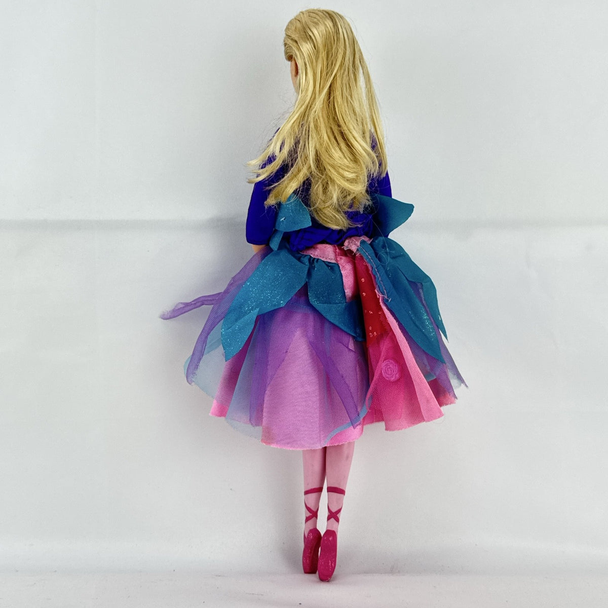 Mattel blonde Barbie ballerina doll in purple bodice and layered pink and teal tulle tutu