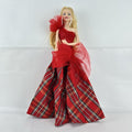 Mattel 2023 Holiday Barbie doll with blonde hair wearing a one-shoulder red plaid and tulle ballgown