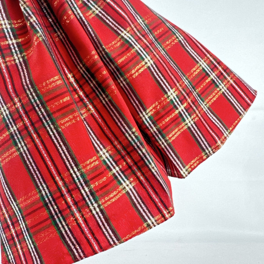 Mattel 2023 Holiday Barbie doll with blonde hair wearing a one-shoulder red plaid and tulle ballgown