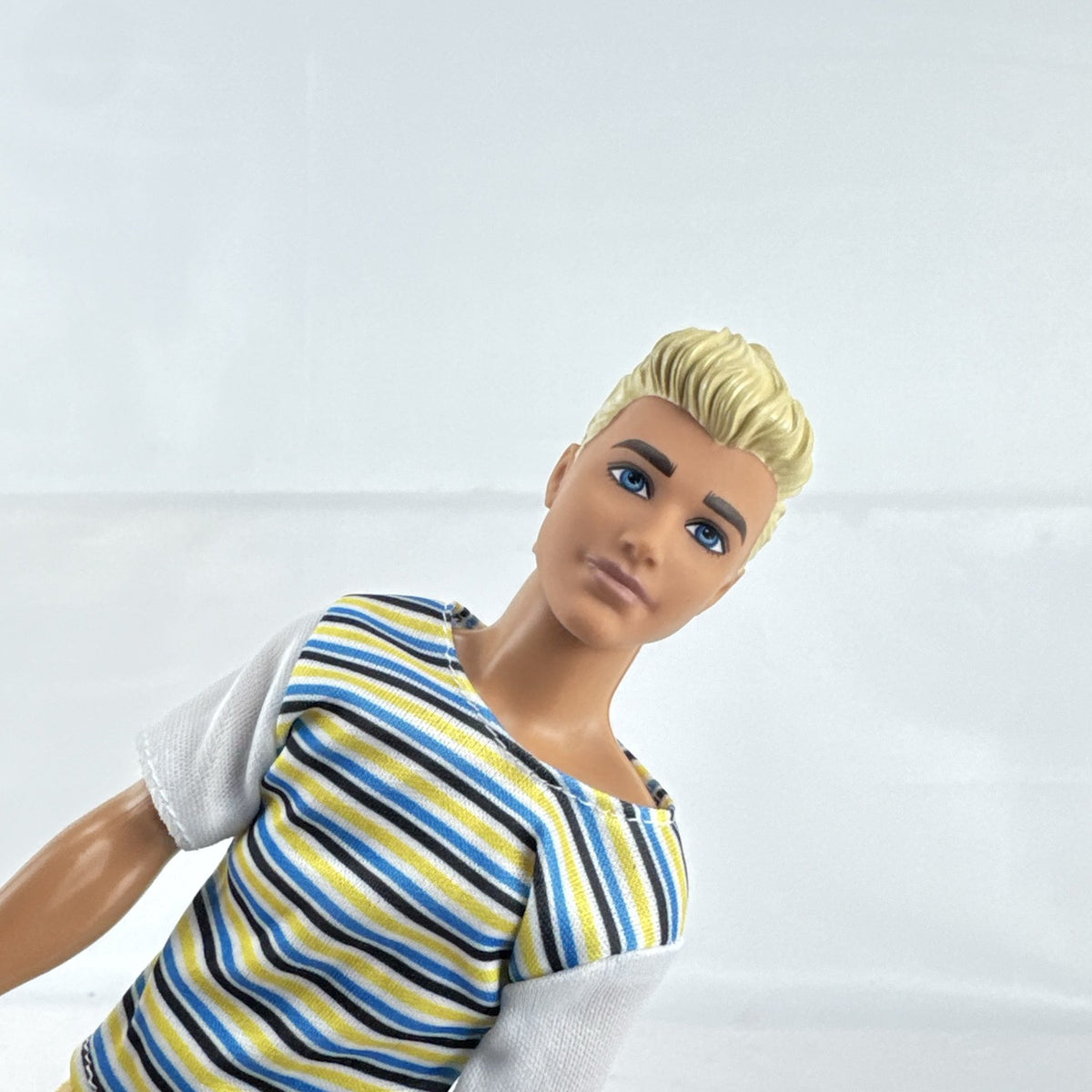Mattel 2016 Ken doll with molded blonde hair in striped t-shirt and yellow shorts