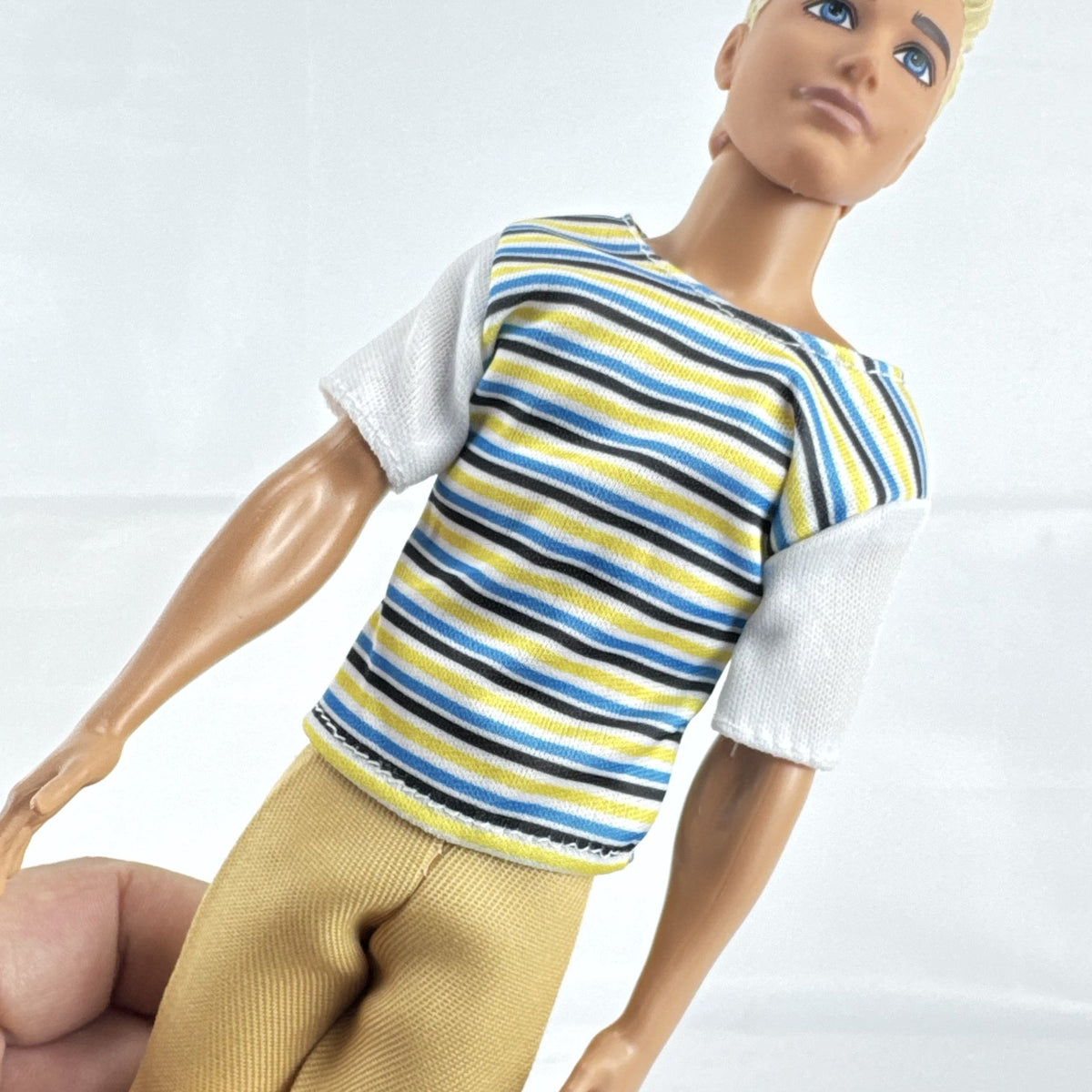 Mattel 2016 Ken doll with molded blonde hair in striped t-shirt and yellow shorts