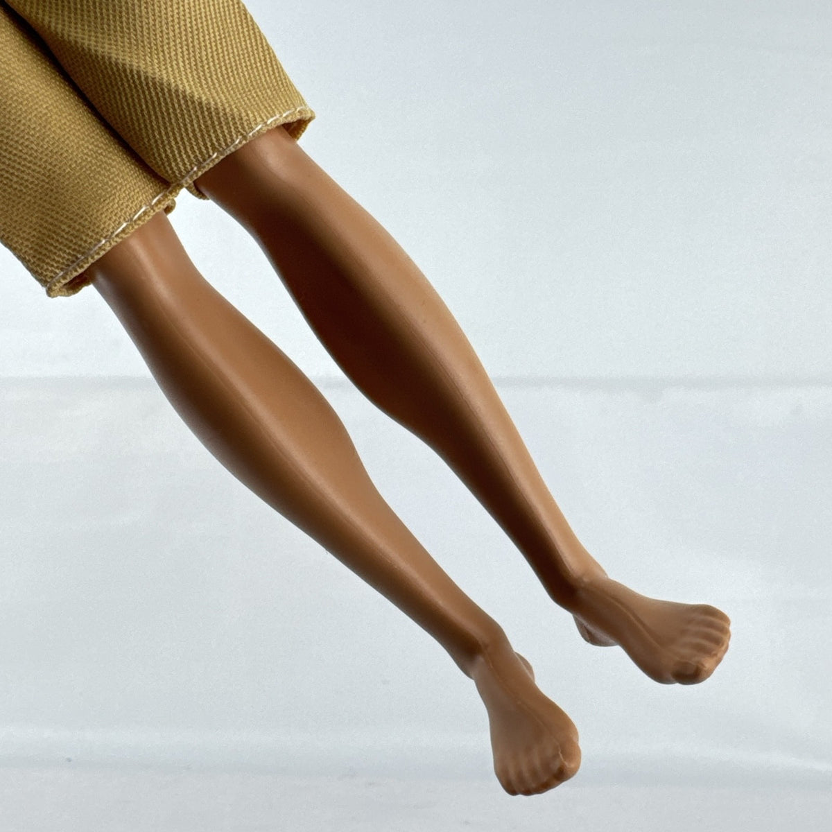 Mattel 2016 Ken doll with molded blonde hair in striped t-shirt and yellow shorts