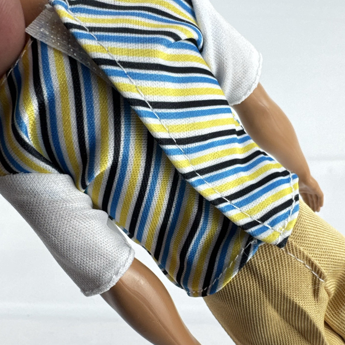 Mattel 2016 Ken doll with molded blonde hair in striped t-shirt and yellow shorts