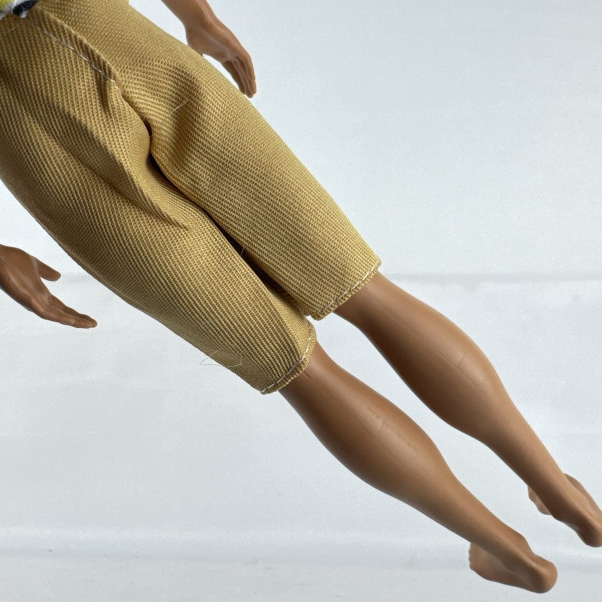 Mattel 2016 Ken doll with molded blonde hair in striped t-shirt and yellow shorts