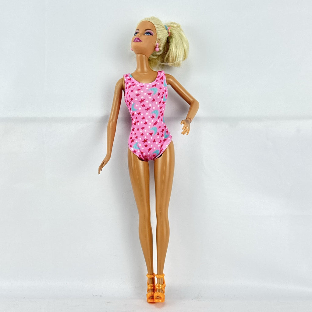 1998 Mattel Barbie doll with blonde side ponytail, celestial star swimsuit, and orange heels