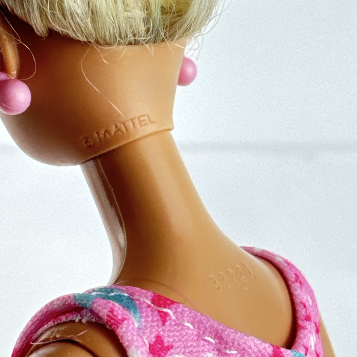 1998 Mattel Barbie doll with blonde side ponytail, celestial star swimsuit, and orange heels