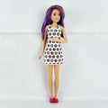 Mattel Barbie Skipper 10-inch doll with purple streaked brown hair in a floral mini dress and pink shoes