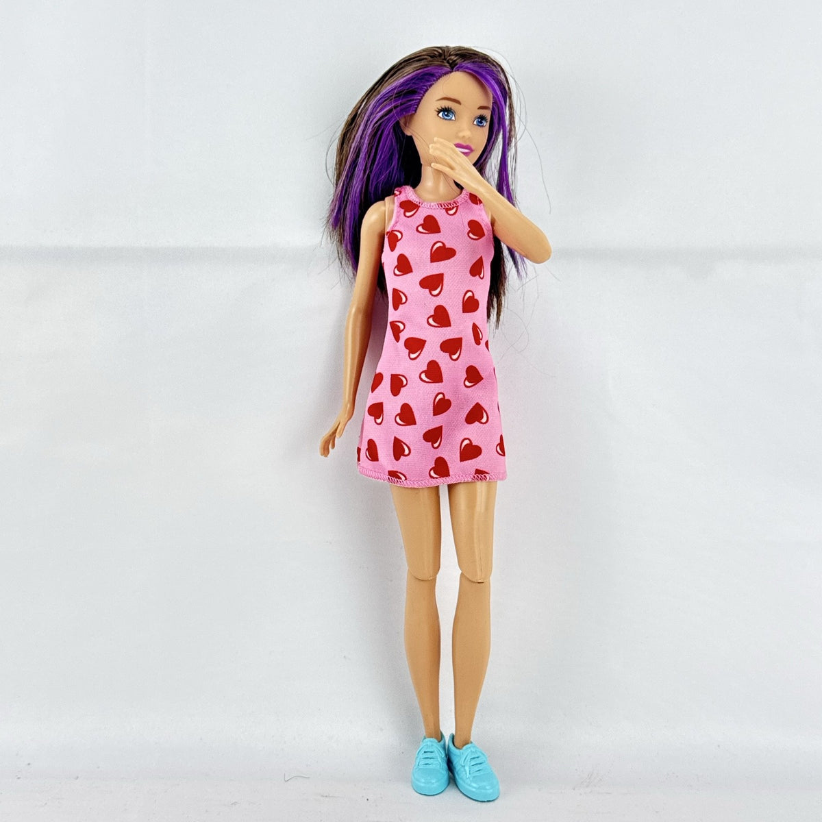 Mattel Barbie Skipper Babysitters Inc. doll with purple hair streaks in pink heart dress