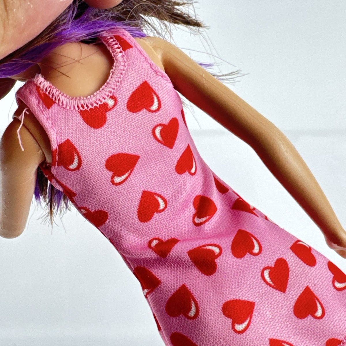 Mattel Barbie Skipper Babysitters Inc. doll with purple hair streaks in pink heart dress