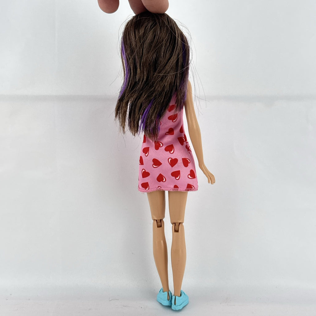 Mattel Barbie Skipper Babysitters Inc. doll with purple hair streaks in pink heart dress