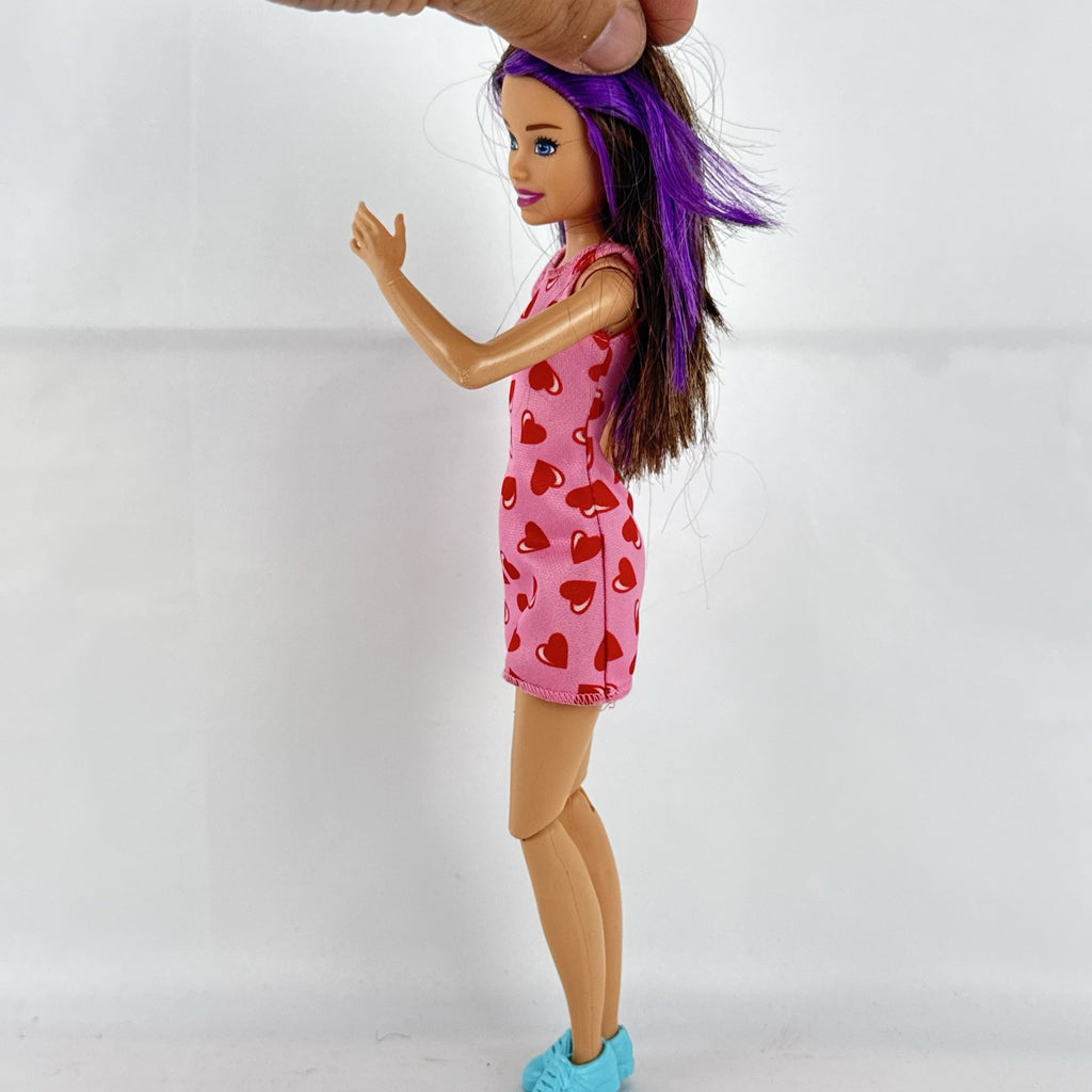 Mattel Barbie Skipper Babysitters Inc. doll with purple hair streaks in pink heart dress