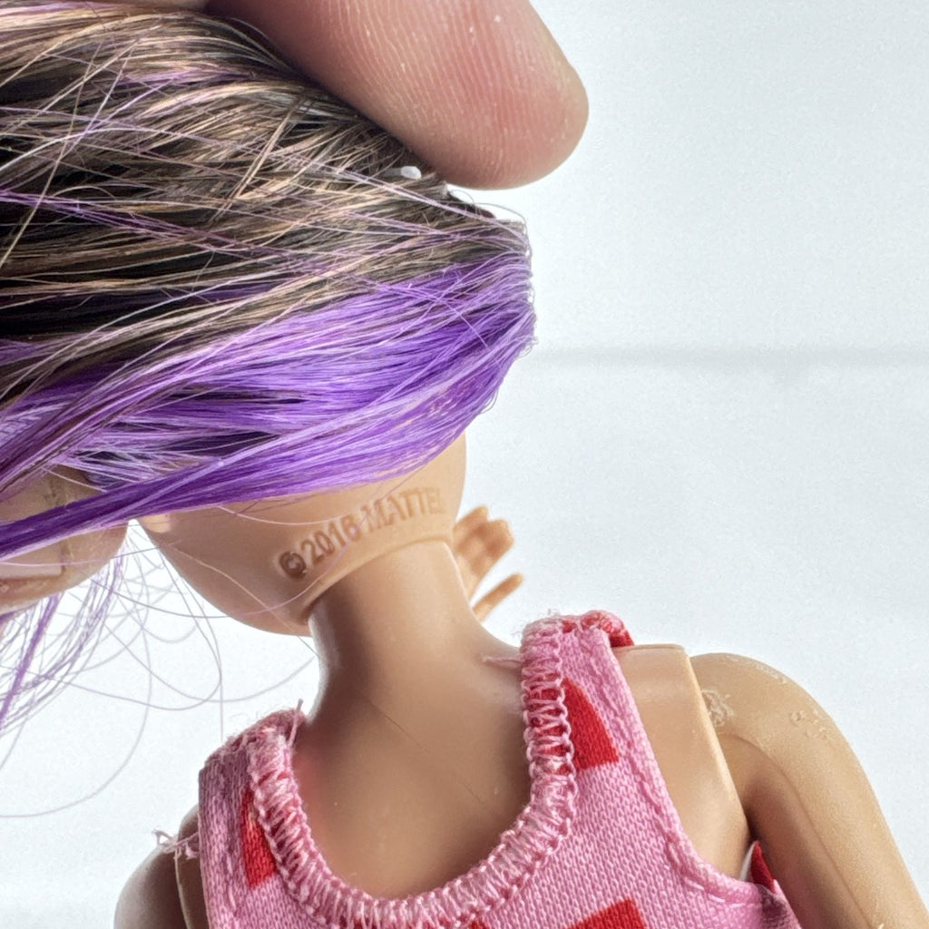 Mattel Barbie Skipper Babysitters Inc. doll with purple hair streaks in pink heart dress