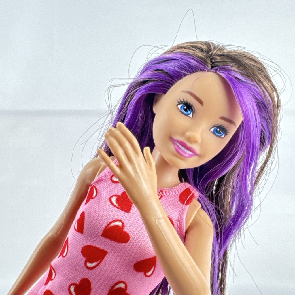 Mattel Barbie Skipper Babysitters Inc. doll with purple hair streaks in pink heart dress