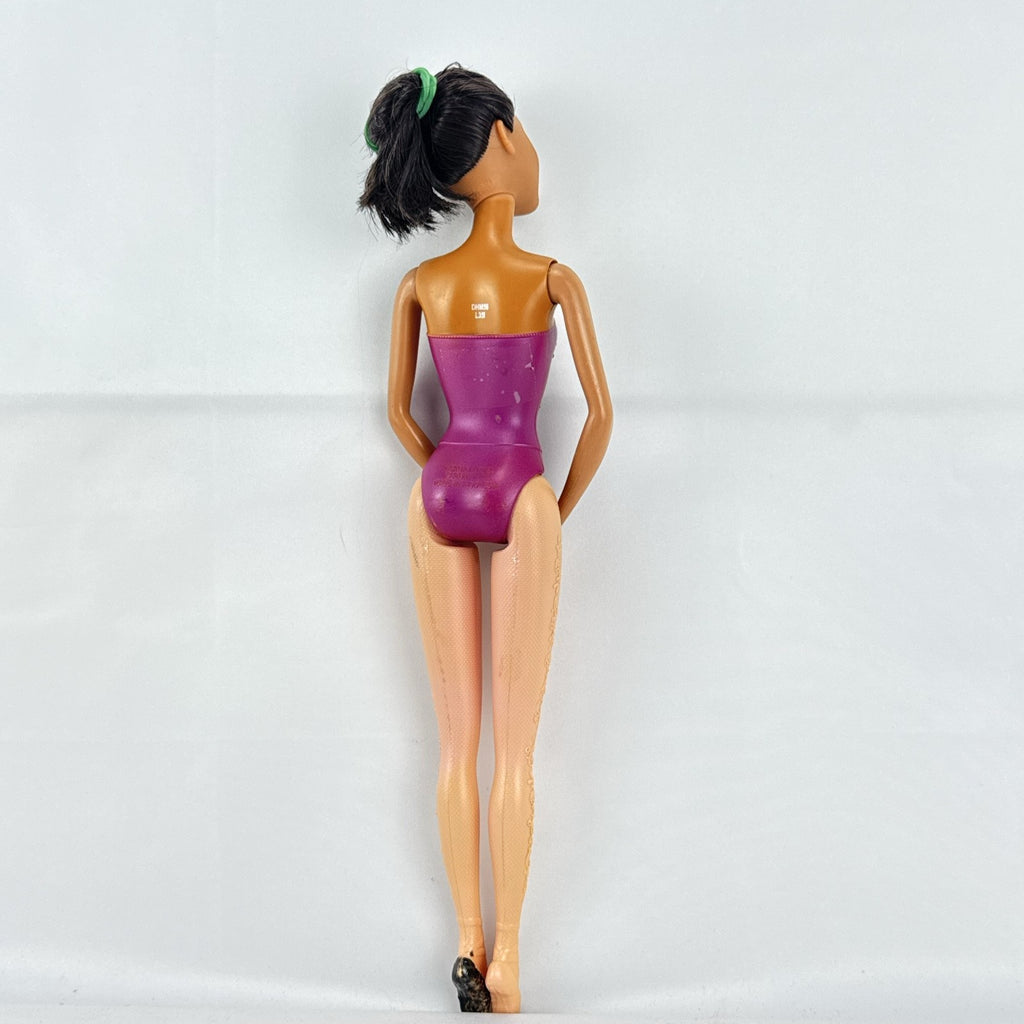 Mattel African American Barbie ballerina doll in molded purple bodice posed on pointe.